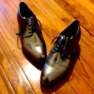 Gold/silver metallic platform shoes.